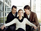 Three businesspeople looking at camera, Munich, Bavaria, Germany