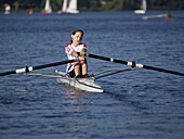 Boy rowing on the Lake Alster, Hamburg, Germany