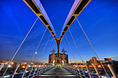 lowry pedestrian suspension footbridge and office block night dusk evening salford quays manchester england uk europe