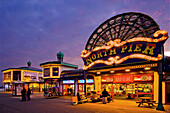 North Pier main entrance at night showing games and slot machines. Blackpool. Lancashire. England. UK