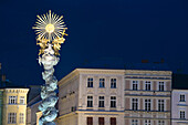 Holy Trinity column at central square at night, Linz, Upper Austria, Austria