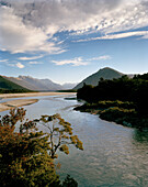 Arawata River and Southern Alps under clouded sky, West Coast, South Island, New Zealand