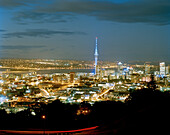 View at the illuminated Central Business District with Sky Tower at night, Auckland, North Island, New Zealand