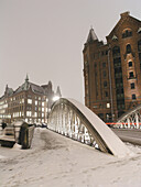 Snow-covered bridge, Speicherstadt (storehouse-town), Hamburg, Germany
