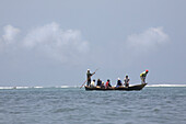 Fishermen in a fishing boat on the Indian Ocean, Kenya, Africa