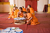 Buddhistic monks eating at monastery Vat Haisok, Vientiane, Laos