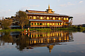 Nga Phe Chaung Kyaung monastary mirrored in the Inle Lake, Shan State, Burma, Myanmar