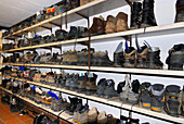 shelf with hiking boots, hut Kemptner Hütte, Allgaeu range, Allgaeu, Swabia, Bavaria, Germany