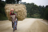 Konso woman carrying straw. South Ethiopia