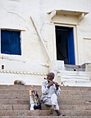 Man playing flute, Varanasi. Uttar Pradesh, India