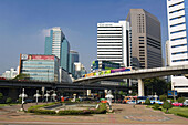 Skytrain with  Hi Rising Buildings of Silom Road, Bangkok. Thailand