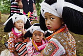 China. Guizhou province. Longjia village. Long Horn Miao girls in traditional costumes celebrating Flower Dance Festival.