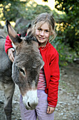 The girl with  the donkey, donkey hiking in the Cevennes, France, Europe