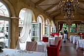 Interior view of Restaurant Villino with waitress, Lindau, Lake Constance, Germany