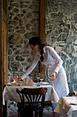 A waitress laying a table, Restaurant Falconera, Öhningen-Schienen, Baden-Württemberg, Lake Constance, Germany
