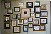 Decoration, photo frames with wine labels hung on the wall, Restaurant Taverne Zum Schäfli, Owner and head chef Wolfgang Kuchler, Wigoltingen, Lake Constance, Switzerland