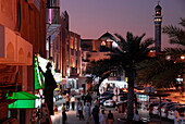 People on the streets of Matrah district in the evening, Muscat, Oman, Asia