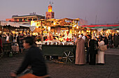 People at the market at dusk, Djamâa el-Fna square, Marrakesh, Morocco, Africa, Morocco, Africa