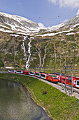 Train passing a lake, Mountain landscape, Furka Pass, Switzerland