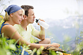 Young couple resting, Werdenfelser Land, Bavaria, Germany