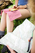 Young woman eating a pretzel, Werdenfelser Land, Bavaria, Germany