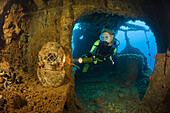 Diver discover Diving Helmet on Brigde of USS Saratoga, Marshall Islands, Bikini Atoll, Micronesia, Pacific Ocean