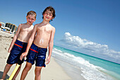 Two boys at the beach under blue sky, South Beach, Miami Beach, Florida, USA