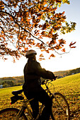 Woman alone outdoors on bicycle