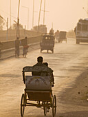 A bicycle rickshaw at sunset in Varanasi, Uttar Pradesh, India