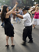 People dance in the street at a dance festival in Buenos Aires, Argentina