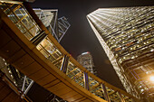 Steel office buildings rise into the night sky. At left is the Bank of China building - designed by I. M Pei. Center is the Citigroup building. In Hong Kong, China, Asia.