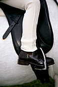 Dressage competitor with boot in stirrup, Rangiora Show, New Zealand