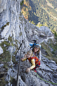 Mother and daughter climbing on Kofel, Ammergau Alps, Bavaria Germany