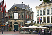 People in a sidewalk cafe in the Old Town, Gouda, Netherlands, Europe