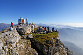 Group of hikers on summit of Grigne, Bergamo Alps, Como, Lombardy, Italy