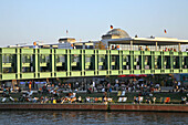 People at the bank of the river Spree and on Gustav Heinemann bridge, Berlin, Germany, Europe