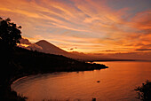 Sunset at the coast and view at Gunung Agung volcano, Bali, Indonesia, Asia