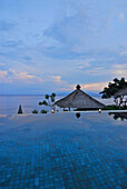 The infinity pool at the Amankila Resort in the evening, Candi Dasa, Eastern Bali, Indonesia, Asia