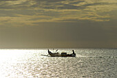 A man going to sea in a boat, Jimbaran, Bali, Indonesia, Asia