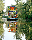 People on an excursion boat between swimming islands, Canales Embarcadero, Xochimilco, Mexico, America