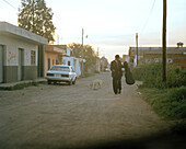A man with guitar in a street of the town Cholula in the evening, Puebla province, Mexico, America
