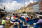 Tourist boat at Nyhavn canal. Copenhagen. Denmark