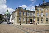 Amalienborg Palace, the winter residence of the Danish royal family and the Frederiks Kirke in background. Copenhagen. Denmark