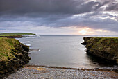 Sunset from Skipi Geo looking towards Brough Head, Mainland Orkney Islands Scotland