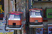 Two coin payphones in a shop in Santacruz district, Mumbai, Maharashtra, India