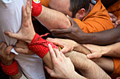 Castellers' building human towers in Plaza Mayor. Vic. Osona. Barcelona province, Catalonia, Spain