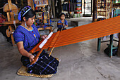 Woman using loom, San Antonio Palopo. Guatemala