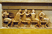An assembly of gods assist at the Troy war. The frieze from the Treasury of the Siphnians decorated with relief representations of mythological scenes. The Museum. Delphi archaeological site. Peloponnese Peninsula. Greece.