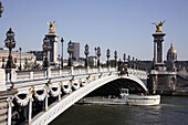 Pont Alexandre III with the Dome Church of Hotel Invalides in the background. Paris. France