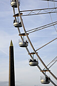 A ferry wheel on Place de la Concorde with the Obelisk from Luxor in the background. Paris. France